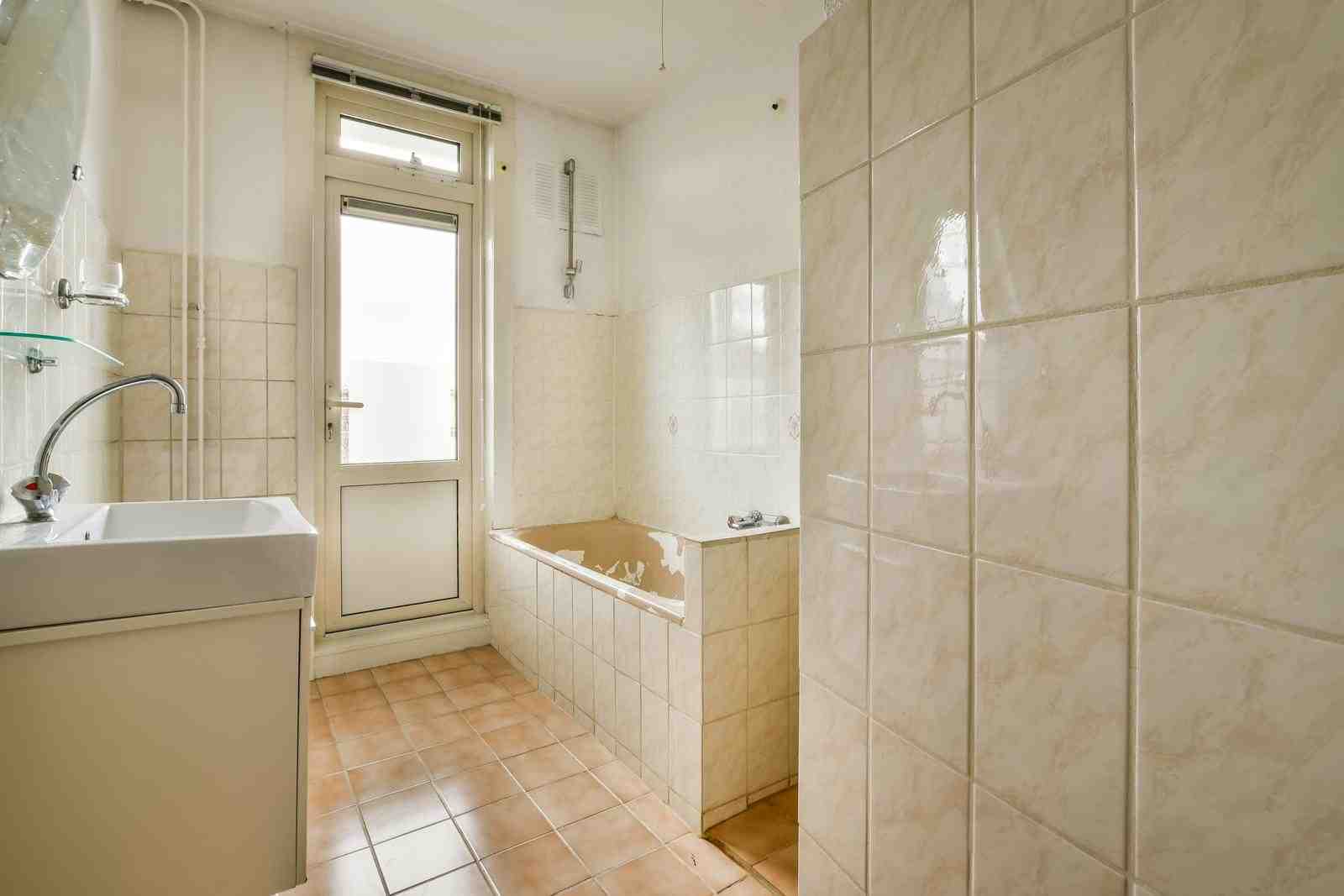 How to Fix a Leaking Pipe behind a Tiled Wall